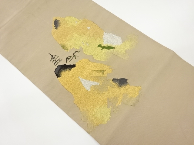 綴れ寺院に抽象模様織出し袋帯